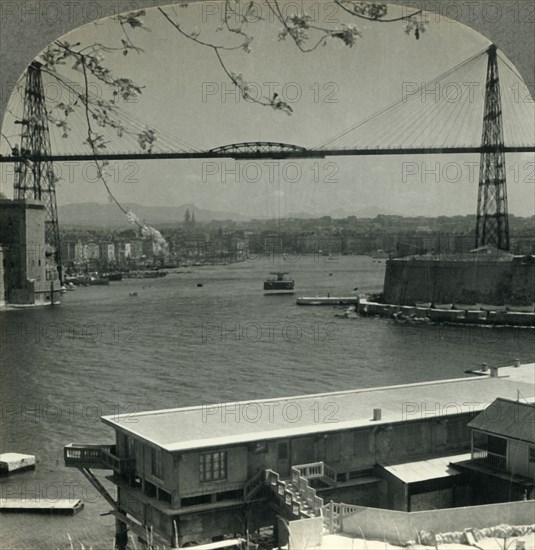 'The Transporter Bridge and Entrance to Old Harbor, Marseilles, France', c1930s. Creator: Unknown.