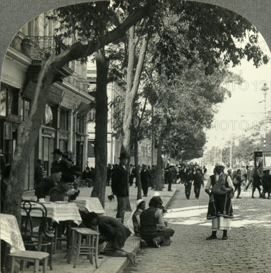 'Street Scene Showing Peasant Woman and Sidewalk Coffee-House, Sofia, Bulgaria', c1930s. Creator: Unknown.