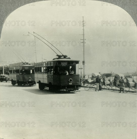 'Trackless Tram Cars in Singapore, Straits Settlement, British Malaya', c1930s. Creator: Unknown.