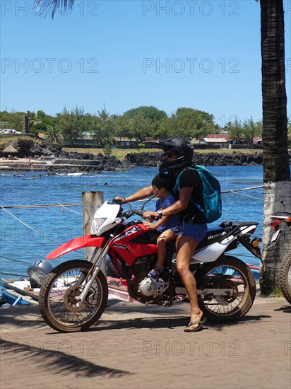 Woman and child on Honda motorcycle, Chile 2019. Creator: Unknown.