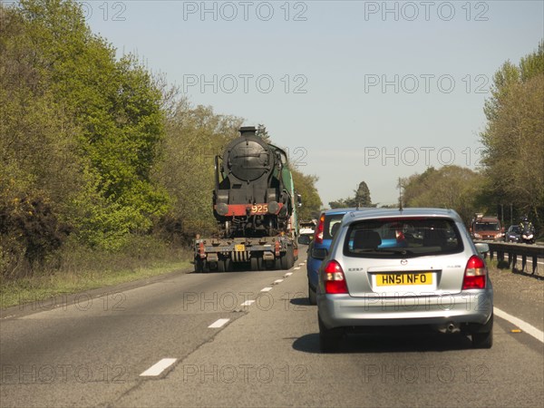 Locomotive being transported by heavy goods vehicle on A31 2015. Creator: Unknown.