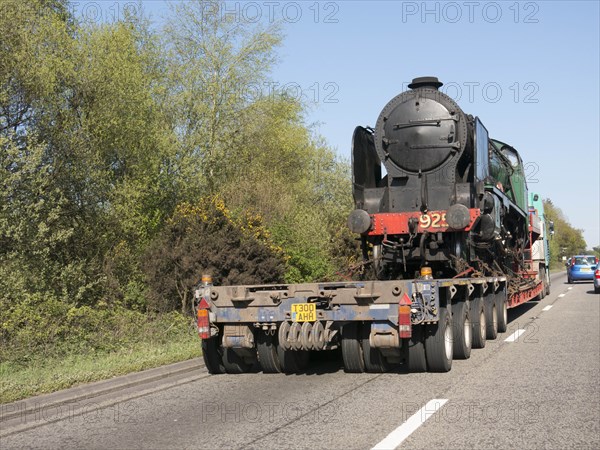 Locomotive being transported by heavy goods vehicle on A31 2015. Creator: Unknown.