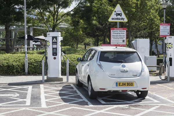 Nissan Leaf at elctric charging point 2015. Creator: Unknown.