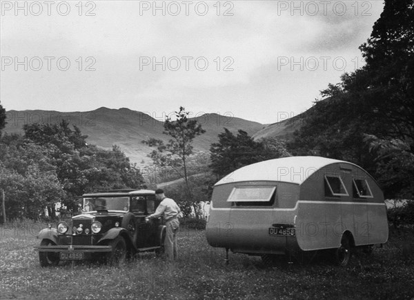 1930 Morris Oxford Six with Winchester Streamline caravan. Creator: Unknown.