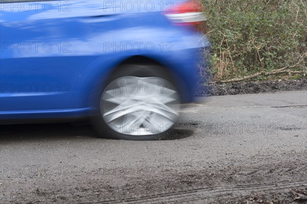 Pot holes in road surface 2017. Creator: Unknown.