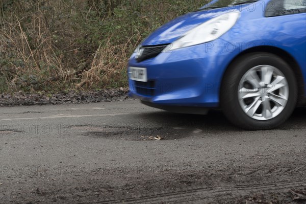 Pot holes in road surface 2017. Creator: Unknown.