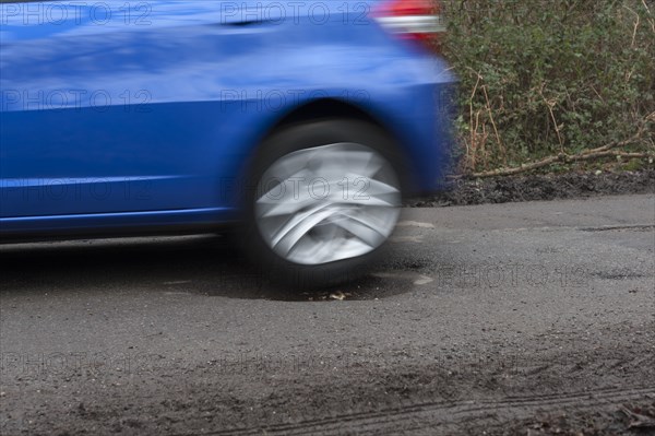 Pot holes in road surface 2017. Creator: Unknown.