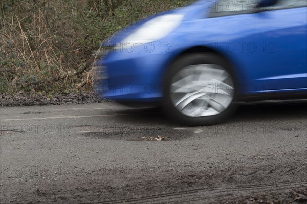 Pot holes in road surface 2017. Creator: Unknown.