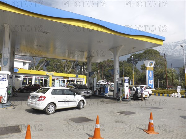 Cars re-fuelling at petrol station Dharamshala Himachal Pradesh. Creator: Unknown.
