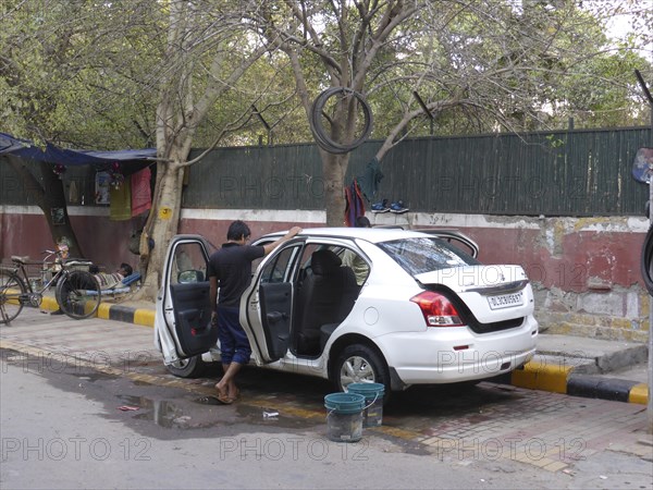 Car washing in Delhi. Creator: Unknown.