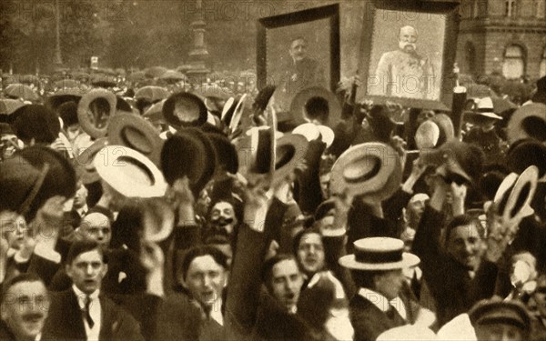 'Hoch the Kaiser!': cheering crowds in the streets, Berlin, Germany, 4 August 1914, (1933).  Creator: Unknown.