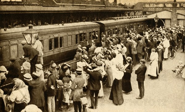 Crowds waving off troops leaving to fight in the First World, War, Britain, 1914, (1933). Creator: Unknown.