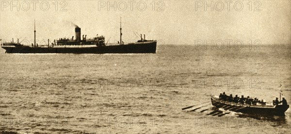 Royal navy cutter about to examine a ship's papers, First World War, 1914-1918, (1933). Creator: Unknown.