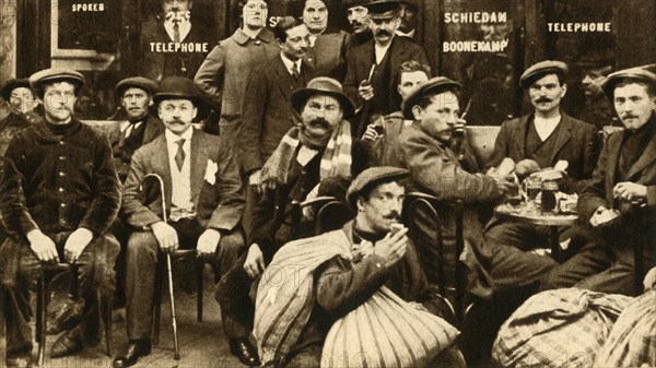 'A group of refugee field-workers at a café in Paris', First World War, 1914-1918, (1933).  Creator: Unknown.