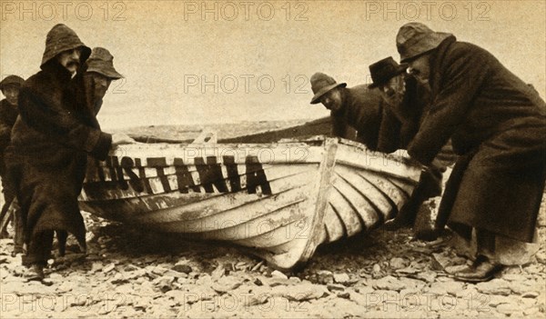 'Hauling up one of the Lusitania's boats', Ireland, May 1915, (1933).  Creator: Unknown.