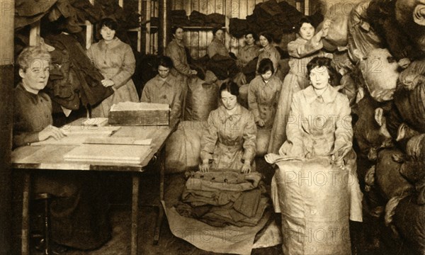 Sorting uniforms at the WAAC clothing store, First World War, 1914-1918, (1933). Creator: Unknown.