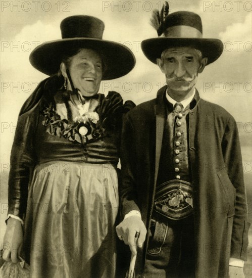 Couple in traditional dress, Sankt Lambrecht, Styria, Austria, c1935.  Creator: Unknown.