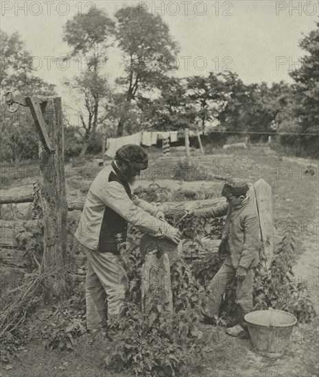At the Grindstone--A Suffolk Farmyard, 1888. Creator: Peter Henry Emerson (British, 1856-1936); Sampson Low, Marston, Searle and Rivington.