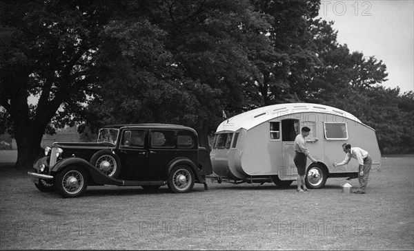 1936 Austin Twenty with caravan. Creator: Unknown.