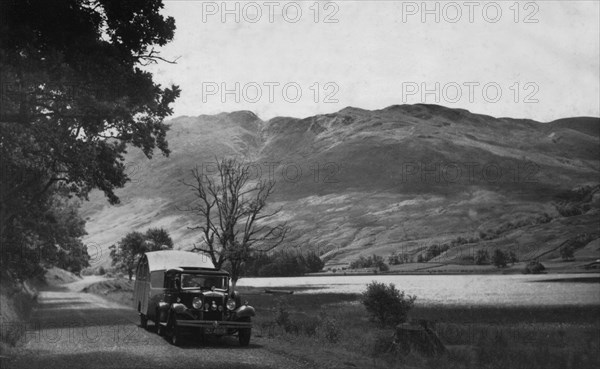 1930 Morris Oxford Six with Winchester Streamline caravan. Creator: Unknown.