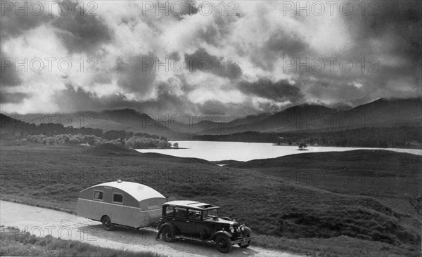 1930 Morris Oxford Six with Winchester Streamline caravan. Creator: Unknown.