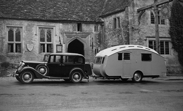 1935 Austin Light 13.9 Ascot saloon with Winchestr Royal caravan. Creator: Unknown.