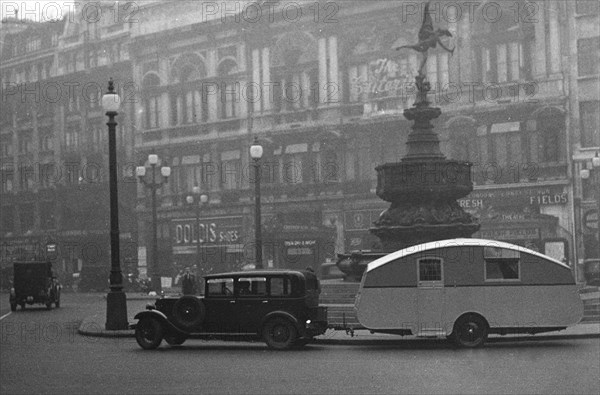 1930 Morris Oxford Six with Winchester Streamline caravan, Picadilly. Creator: Unknown.