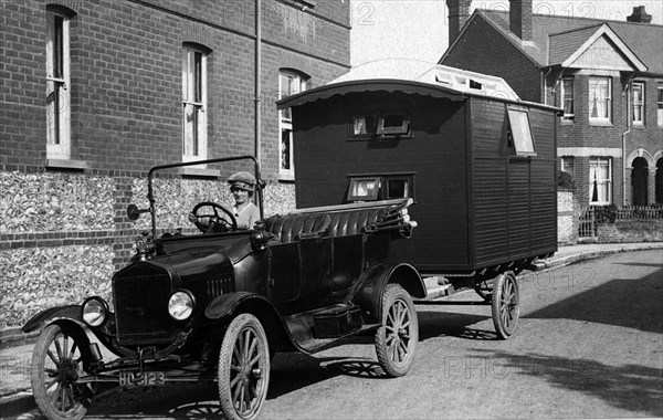 1921 Ford Model T with caravan. Creator: Unknown.