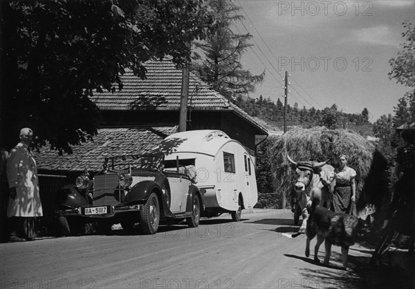 1937 Mercedes Benz 260D Cabriolet towing caravan. Creator: Unknown.