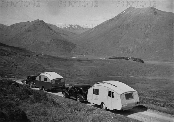 1936 Austin Twenty with caravan and 1936 Oldsmobile Eight with caravan. Creator: Unknown.