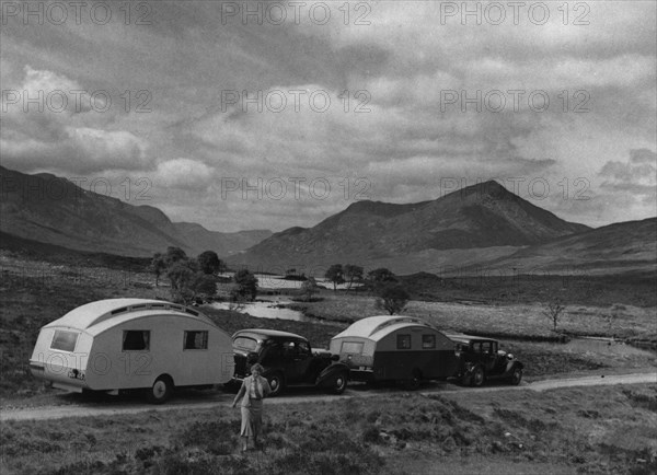 1936 Austin Twenty with caravan and 1936 Oldsmobile Eight with caravan. Creator: Unknown.