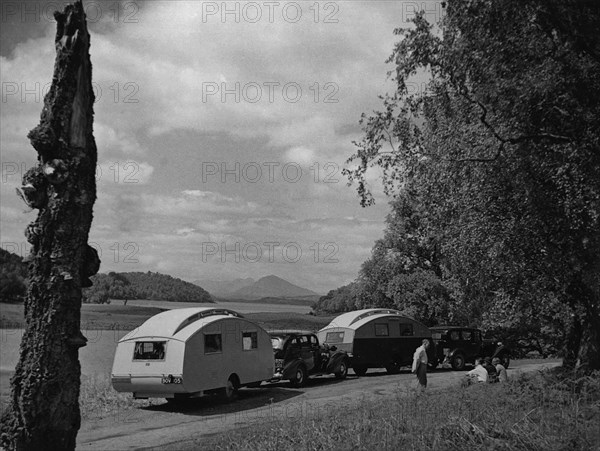 1936 Austin Twenty with caravan and 1936 Oldsmobile Eight with caravan. Creator: Unknown.