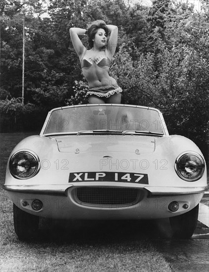 1959 Elva with posing female model. Creator: Unknown.