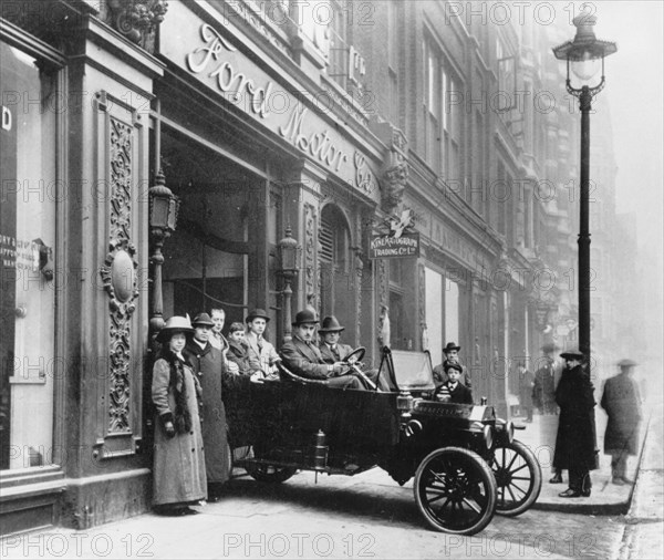 Ford Model T leaving showroom circa 1911. Creator: Unknown.