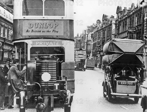 World War 2 street scene show gas converted vehicles. Creator: Unknown.