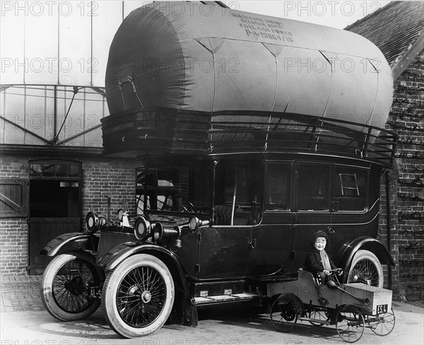 1913 Lanchester with gas bag conversion and boy in pedal car. Creator: Unknown.