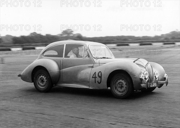 1947 Healey Elliott 2.4, E.B Wadworth at Silverstone 1956. Creator: Unknown.