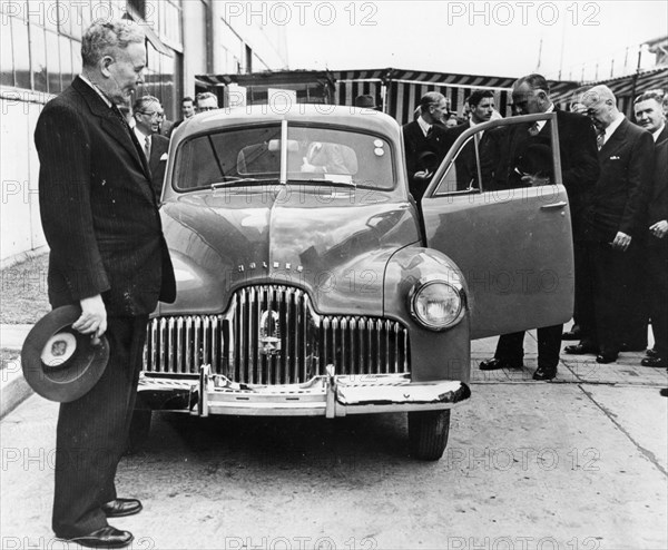 1948 Holden 48-215 with Australian Prime Minister J.B. Chifley. Creator: Unknown.