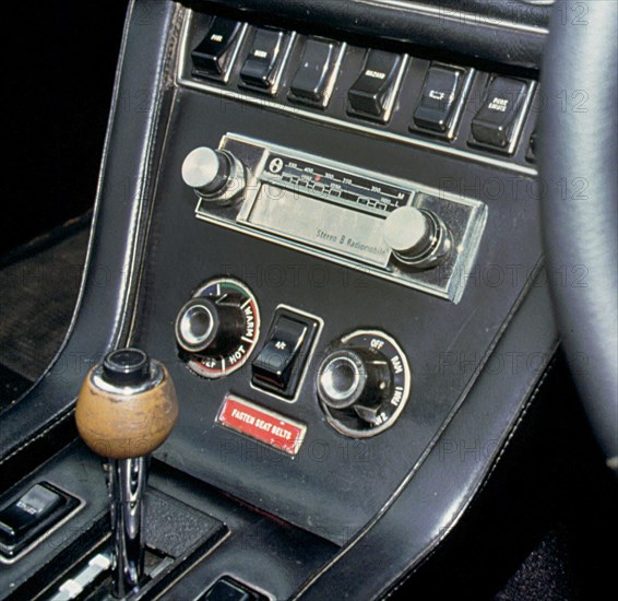 1974 Jensen Interceptor dashboard showing 8 track cartridge sound system. Creator: Unknown.