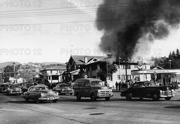 Fire in building causing traffic to slow, Glendale, Burbank, California 1951. Creator: Unknown.