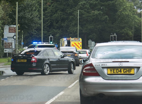 Ambulance attending road traffic accident, A35 Hampshire 2017. Creator: Unknown.