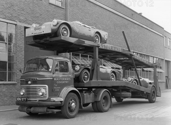 Daimler Dart SP250s on car transporter for delivery 1960. Creator: Unknown.