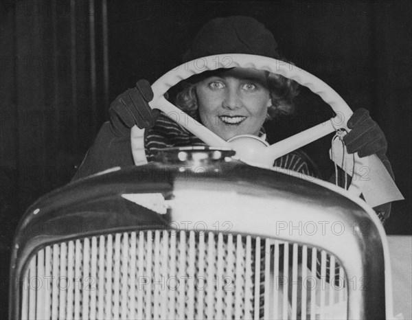 Female model in Hillman Minx at 1933 Motor Show. Creator: Unknown.