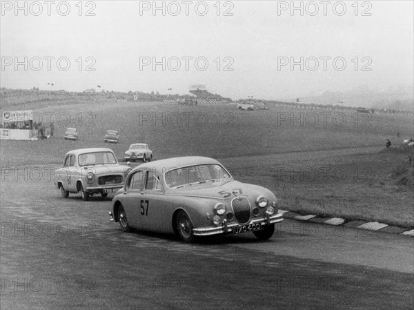 Jaguar 3.4 Mark1 at Brands Hatch 1957. Creator: Unknown.