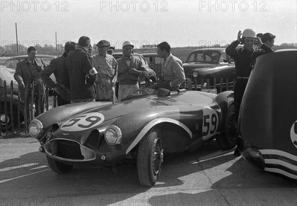 Aston Martin DB3S, Stirling Moss in paddock at Goodwood International Sports Car Race 1956. Creator: Unknown.