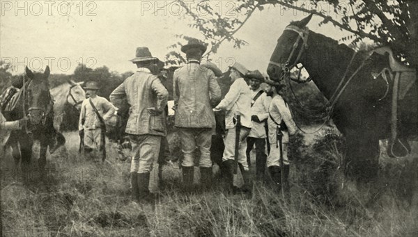 'General Lawton Learning from Cuban Officers...June 30th', Spanish-American War, 1898, (1899). Creator: Burr McIntosh.