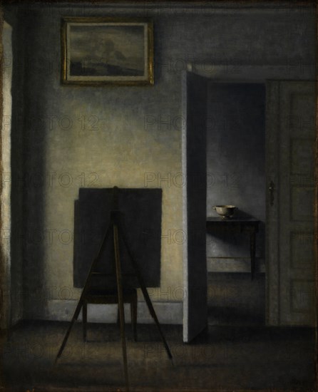 Interior with the Artist's Easel, 1910. Creator: Hammershøi, Vilhelm (1864-1916).