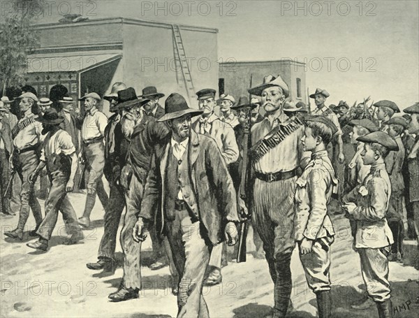 'The Last Attack on Mafeking: B.S.A. Police Escorting Boer Prisoners to the Gaol', 1901. Creator: Henry Marriott Paget.