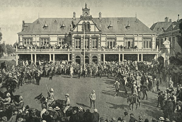 'Hauling Down the Transvaal Flag at Johannesburg', 1901. Creator: Lionel James.