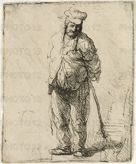 Ragged Peasant with his Hands behind Him, holding a Stick, c.1630. Creator: Rembrandt Harmensz van Rijn.